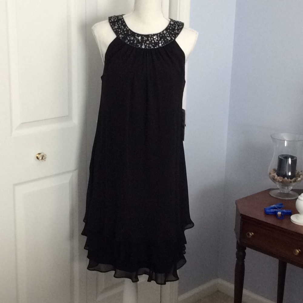 Beautiful Ruffle bottom dress with sequin neckline